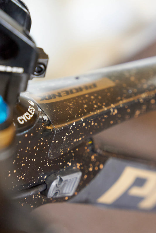 RideStyle clear glossy frame protection film installed on a mountain bike frame for scratch and impact protection.